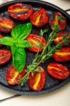 Baked Cherry Tomatoes With Basil And Thyme Stock Photo