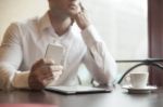 Businesman With Smartphone In Cafe Stock Photo