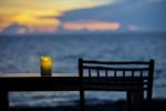 One Candle On The Table Stock Photo