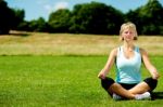 Middle Aged Woman Doing Meditation Stock Photo