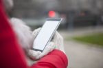 Mobile Phone In Hands With Glowes, Cold Weather Stock Photo