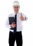 Smiling Architect Showing Thumbs Up Stock Photo