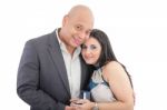 Happy Couple Holding A Box With A Ring Isolated Stock Photo