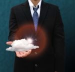 Businessman Holding Cloud Stock Photo