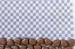 Chocolate Hearts On Fabric Stock Photo