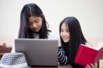 Two Asia Thai High School Student Uniform Best Friends Beautiful Girl Using Her Laptop Stock Photo