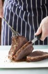 Roast Meat Is Being Carved Stock Photo