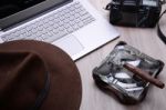 Closeup Of A Wooden Table With Laptop Stock Photo