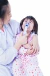 Doctor Helps Little Girl To Do Inhalation Stock Photo