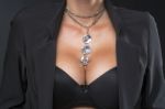 Woman With Big Breasts And Jewelry On Neck Stock Photo