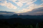 Sweet Sunset Sky With Big Mountains Background Stock Photo