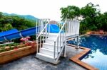 The Wooden Staircase To Water Slide Tube To The Pool Stock Photo