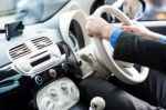 Hands Of A Man On Steering Wheel Of A Car Stock Photo