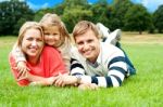 Lying Family In Outdoors Stock Photo