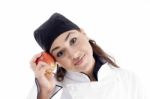 Female Chef Holding Red Apple Stock Photo