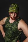 Military Style Camouflage On The Soldier's Face Stock Photo