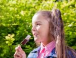 Girl Eating Ice Cream Outside Stock Photo