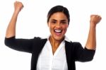 Excited Woman With Clenched Fists Stock Photo