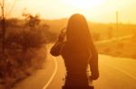 Woman Exercising Outdoor At Sunset  Stock Photo