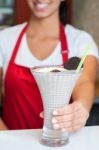 Female Chef Serving Milk Shake Stock Photo