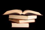 Pile Of Books With A Black Background Stock Photo