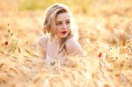 Portrait Of Beautiful Girl In Field Stock Photo