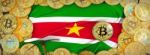 Bitcoins Gold Around Suriname  Flag And Pickaxe On The Left.3d I Stock Photo