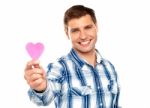 Man Showing Pink Paper Heart Stock Photo