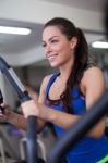 Young Woman Working Out On A Stepper Stock Photo