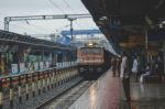 People Watching As A Train Approaches Stock Photo