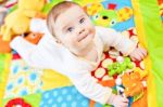 Infant Boy On Playmat Stock Photo