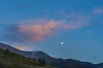 Moon Rising Over The Cairngorm Mountains Stock Photo