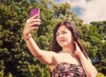 Young Girl Making Selfie In A Park Stock Photo