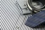 Tie And Belt On Striped Shirt Background Stock Photo