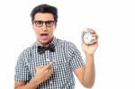 Excited Man Holding An Antique Clock Stock Photo