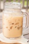 Iced Milk Coffee On Wooden Table Stock Photo