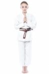 Beautiful Karate Girl In Welcoming Gesture Stock Photo