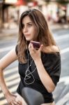 Woman On The Phone In The Street Stock Photo