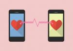 Two Hearts Icon Was Connected By Two Smartphones Stock Photo