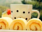 Coffee Swiss Roll Indicates Orange Flavored Cake And Break Stock Photo