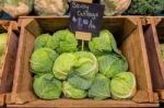 Fresh Cabbage Vegetable In Wooden Box Stall In Greengrocery With Price Chalkboard Label Stock Photo