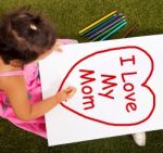 Child With I Love My Mom Message Stock Photo