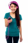 Pretty Girl Listening To Music Stock Photo