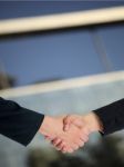 Businesspeople handshaking Stock Photo