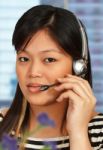 Girl Talking Over Headset Stock Photo