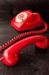 Retro Vintage Red Landline Unhang On Wooden Background Stock Photo