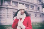 Beautiful Woman In Red Coat And Wool Cap And Gloves With Smartph Stock Photo