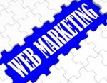 Web Marketing Puzzle Shows Internet Sales Stock Photo