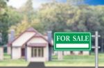 Home For Sale With Green For Sale Sign Stock Photo