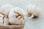 Garlic On Concrete Floor Stock Photo